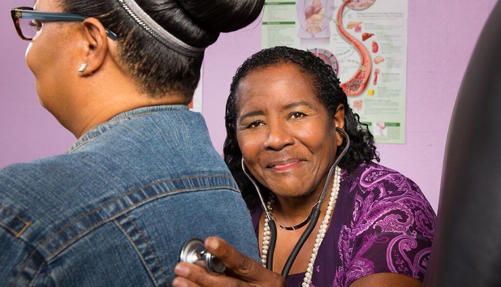 Gloria McNeal checks out a patient 