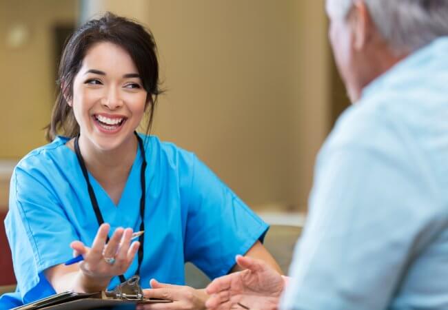 Nurse Practitioner talks to patient
