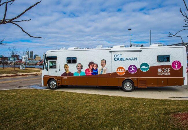  Nurses, using this 40-foot mobile medical clinic, go into the community to to promote access to care, reduce food insecurity, and improve health outcomes in two nearby underserved communities.