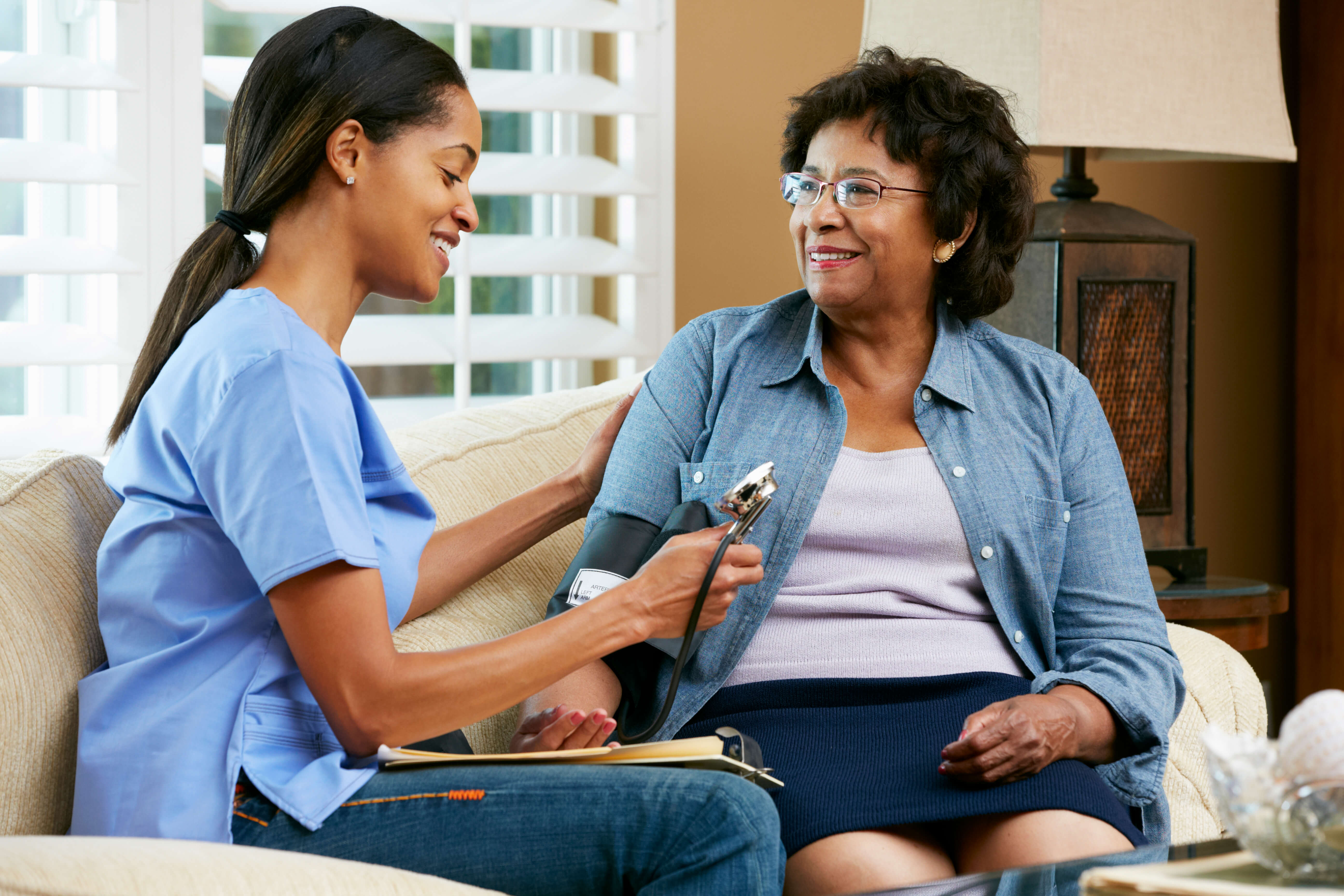 Nurse Visiting Senior Female Patient At Home Campaign For Action 